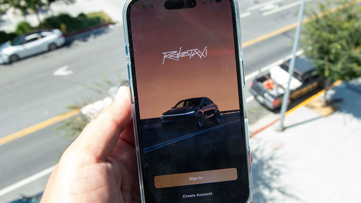 Tesla Robotaxi app on phone screen