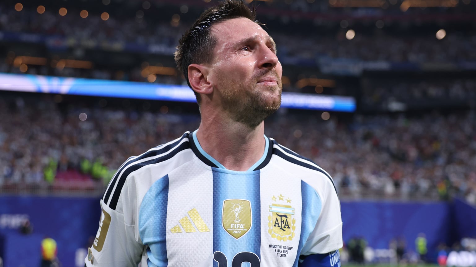 Lionel Messi stands on the pitch during a World Cup match