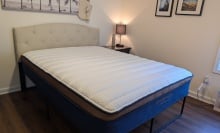 the brooklyn bedding copperflex pro mattress in a bedroom with a nightstand