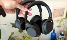 sony xm5 and xm6 headphones held in hand