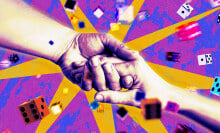 Hands shaking surrounding by dice