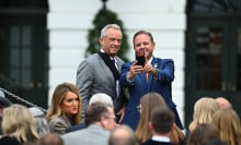 RFK Jr. takes a selfie with an event attendee on the White House lawn. 