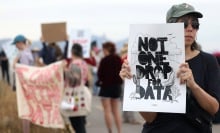 Demonstrators hold signs during a protest against the Project Blue data center in Tucson, Arizona