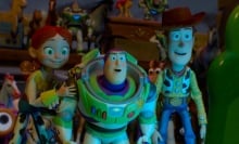 Jessie, Buzz, and Woody look at a digital screen in "Toy Story 5."