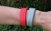 the google fitbit air on a wrist with greenery behind