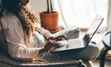 A woman on her laptop.