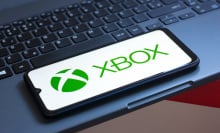 the XBOX logo is seen displayed on a smartphone screen