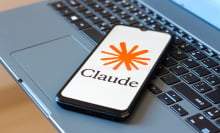  the Claude AI logo is seen displayed on a smartphone screen
