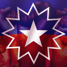 The dark red, blue and white Juneteenth flag overlaid with raised fists