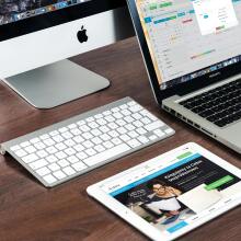 Tablets, monitors, laptops on table
