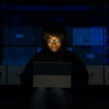 Girl looking at laptop