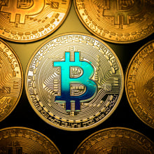 Coins with the bitcoin logo.
