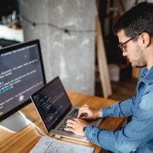 A man learns code on his computer.