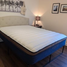the brooklyn bedding copperflex pro mattress in a bedroom with a nightstand