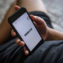 Roblox logo on phone screen
