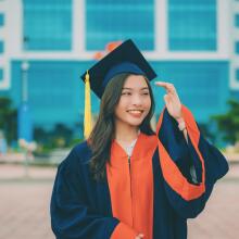 woman wearing graduation cap and gown
