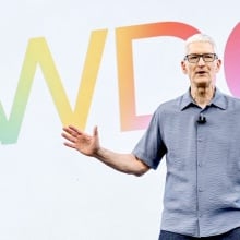 Apple CEO Tim Cook in front of the letters WWDC in different colors