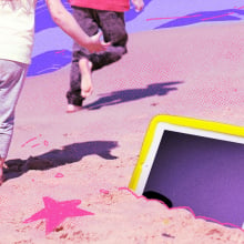 Kids leave a tablet in the sand as they have fun during the summer off screens.