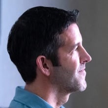 John Ternus looking on at an Apple event.