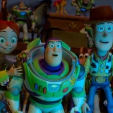 Jessie, Buzz, and Woody look at a digital screen in "Toy Story 5."