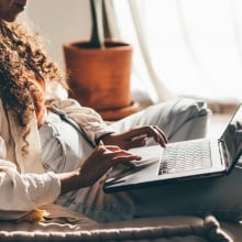 A woman on her laptop.