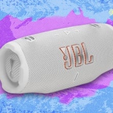 JBL Charge 6 portable speaker against a light blue patterned background