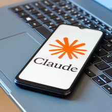  the Claude AI logo is seen displayed on a smartphone screen