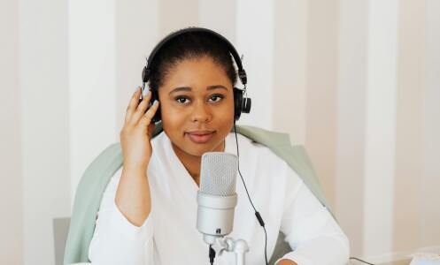 Woman speaking on podcast