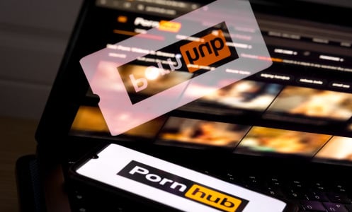pornhub logo on phone and blurred site on screen