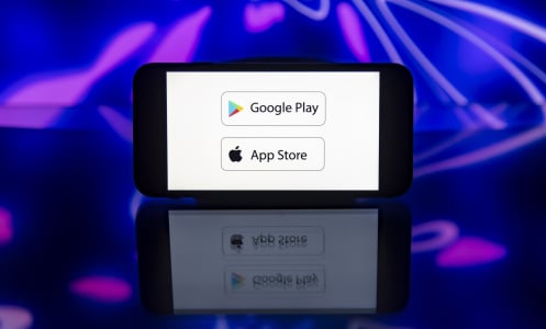 google play and apple app store logos on smart phone