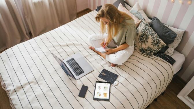 Girl on bed with laptop