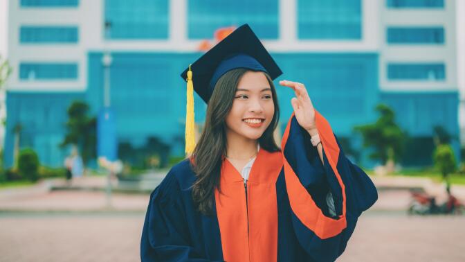 woman wearing graduation cap and gown