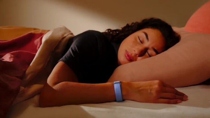 a person wears the blue google fitbit air while sleeping