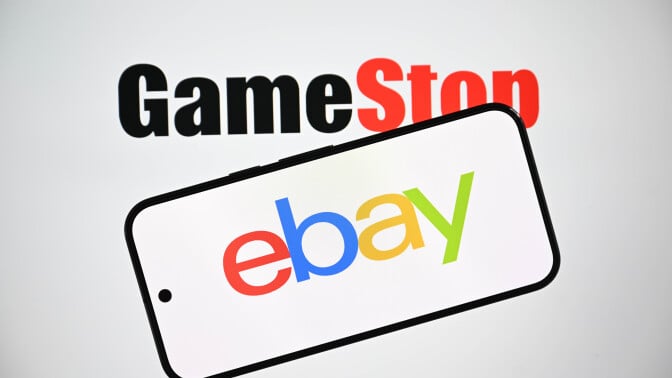 Gamestop logo is displayed in the background while the eBay logo is shown on a mobile phone screen 