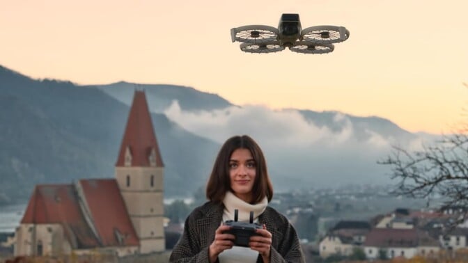 a person uses the DJI RC 2 remote to control the DJI Flip drone in a low-light situation that looks like sunset