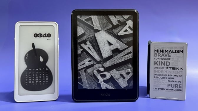 Three e-readers on a purple background