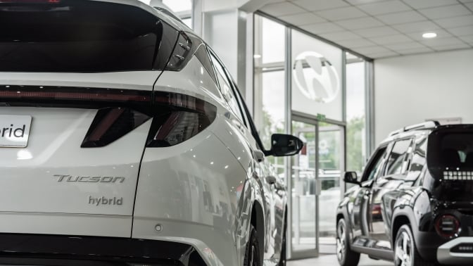 The rear of a Hyundai Tuscon in a gleaming showroom.