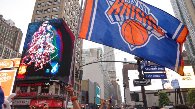 New York Knicks fans celebrate their advancement to the Eastern Conference Finals in the Madison Square Garden area