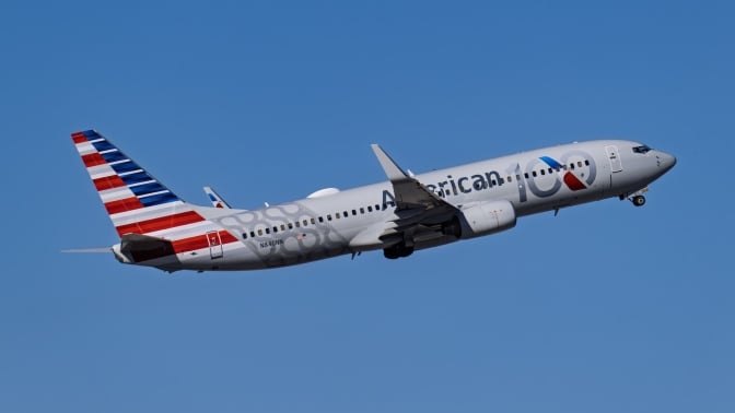 An American Airlines plane in the sky.