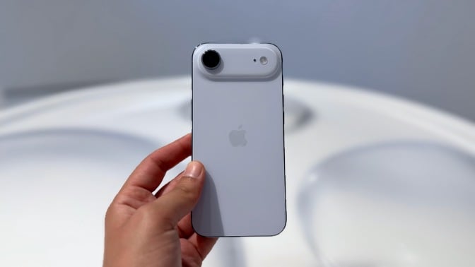 iPhone Air held in hand with rear camera in view