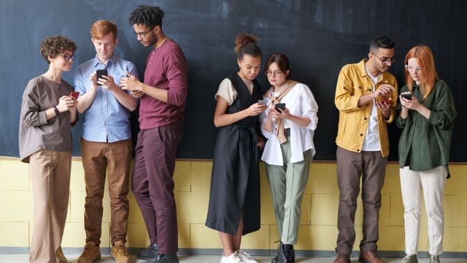 Group looking at phones