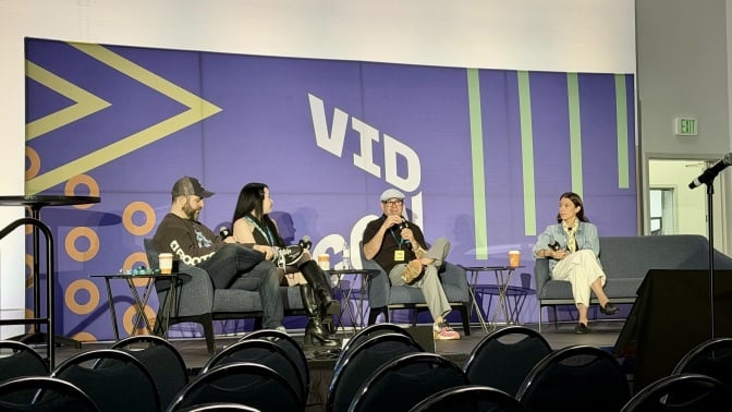 panel attendees sit on stage on vidcon