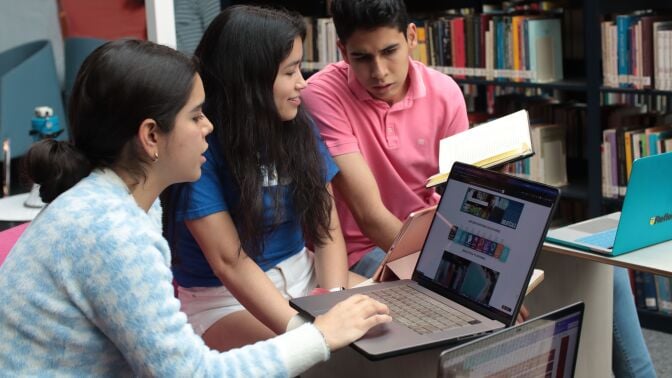 People looking at laptop