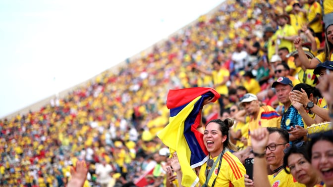 Colombia fans cheer in the stands