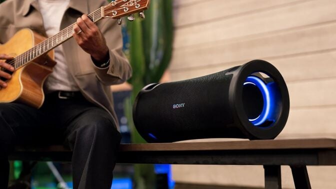 Sony ULT field 7 speaker next to man playing guitar
