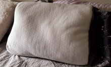 memory foam pillow sitting on bed