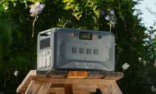 Bluetti Apex 300 portable power station sitting on table outdoors