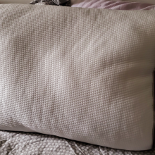 memory foam pillow sitting on bed