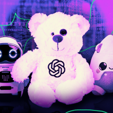 A small robot, stuffed bear with OpenAI logo, and Grok toy. 