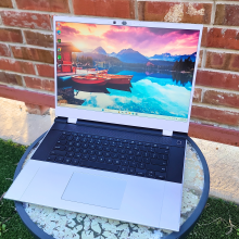 framework 16 laptop outside against a brick wall